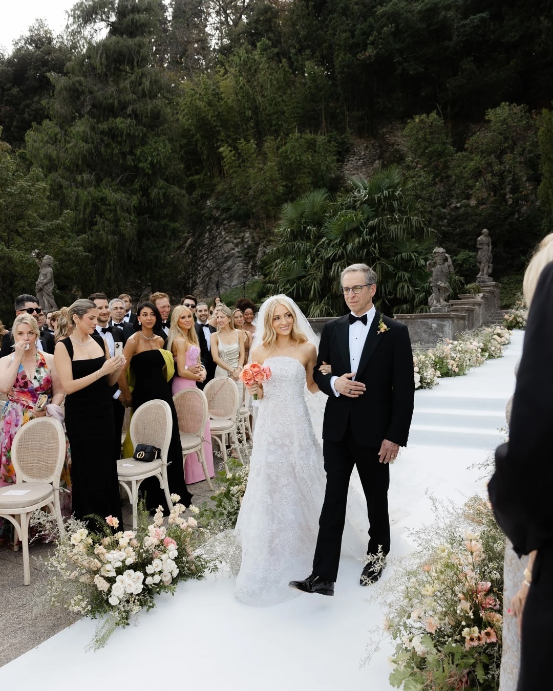 Bride walking into an outdoor wedding ceremony