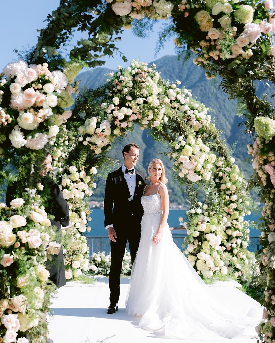 Lake Como wedding couple framed by florals